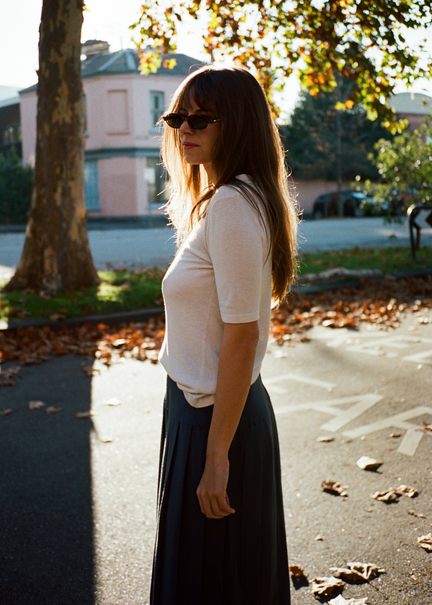 vintage white polo top. film outside.