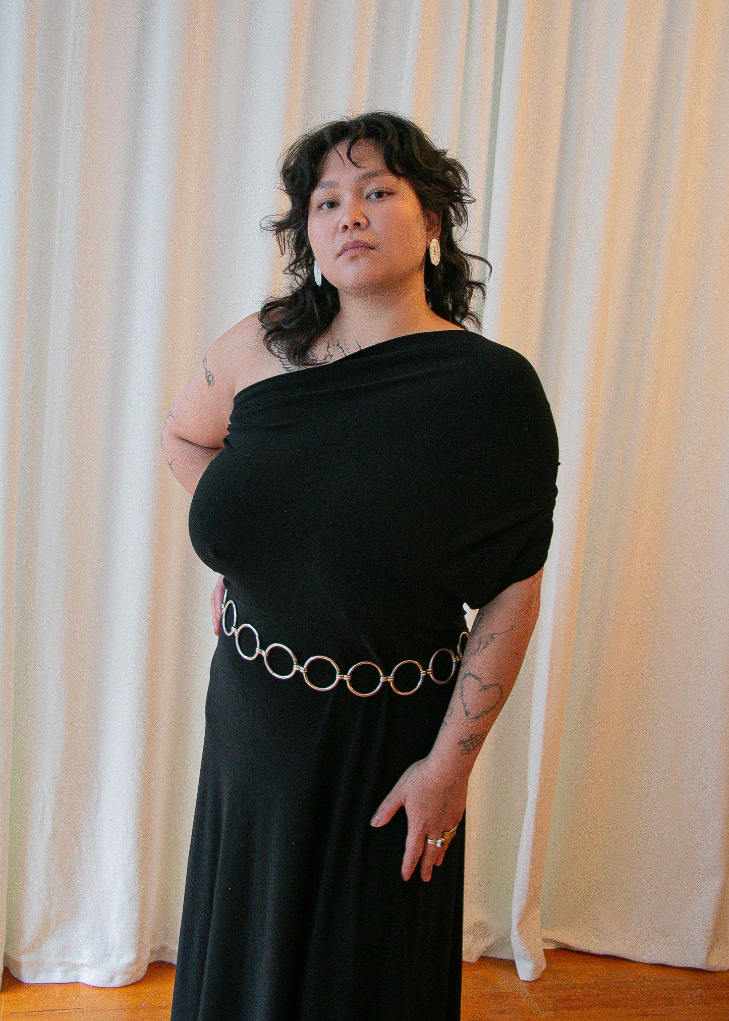 vintage black evening dress. front belted.