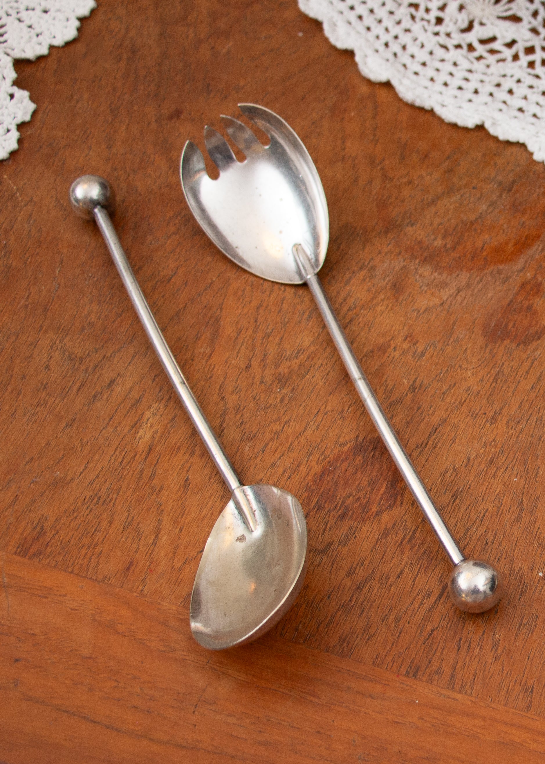 vintage serving spoons. wood background.