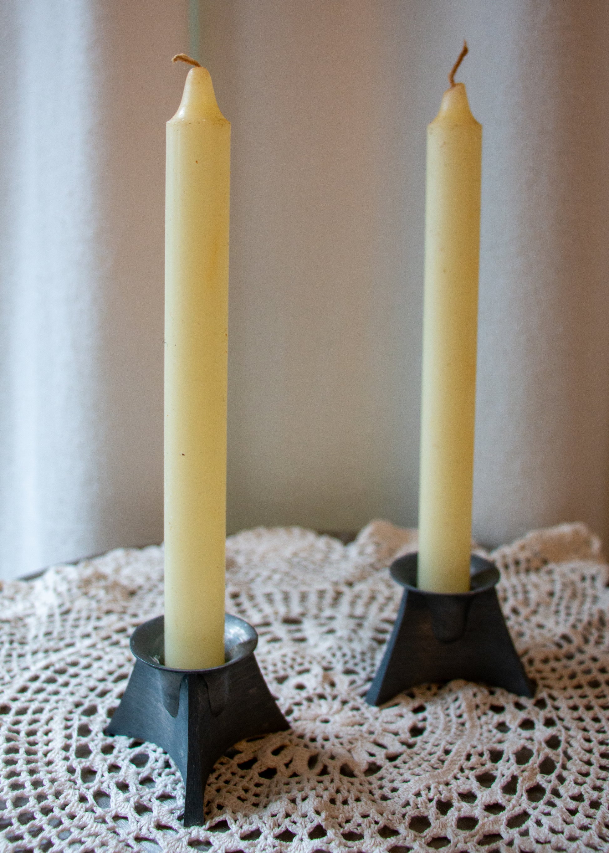 vintage candleholder pair. front detail.